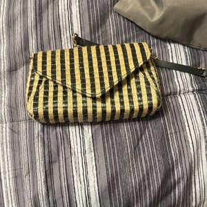 This never worn before cross shoulder purse is brand new